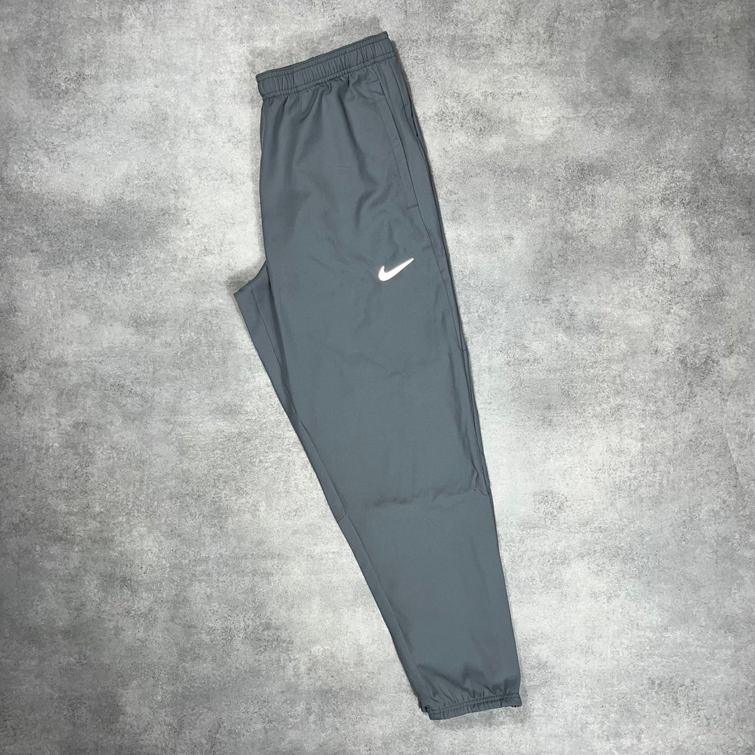 Nike Essentials Windbreaker Jacket Grey & Grey Woven Challenger Bottoms Set